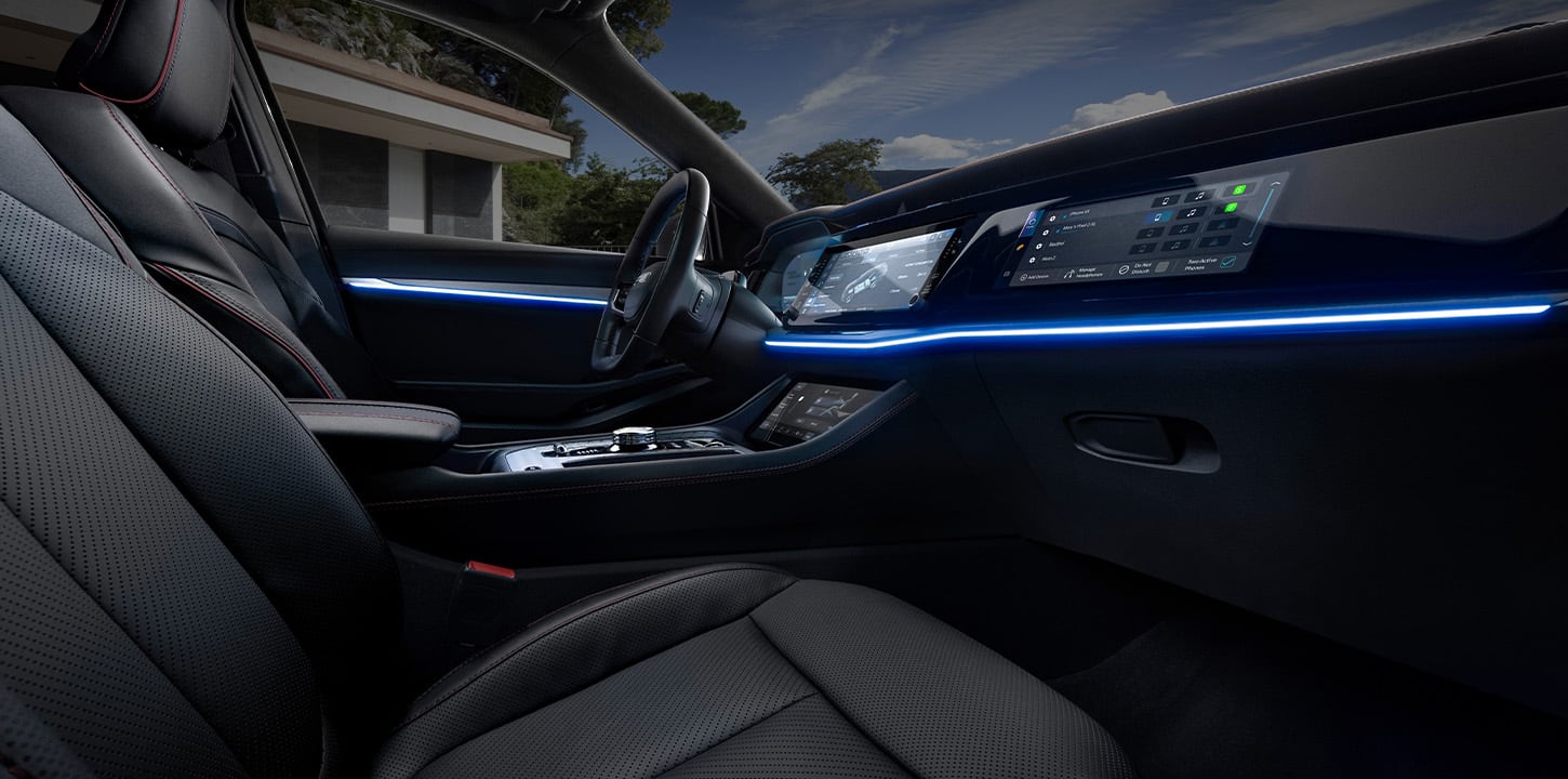 2025 Jeep Wagoneer S front cabin with ambient lighting and dashboard screens.