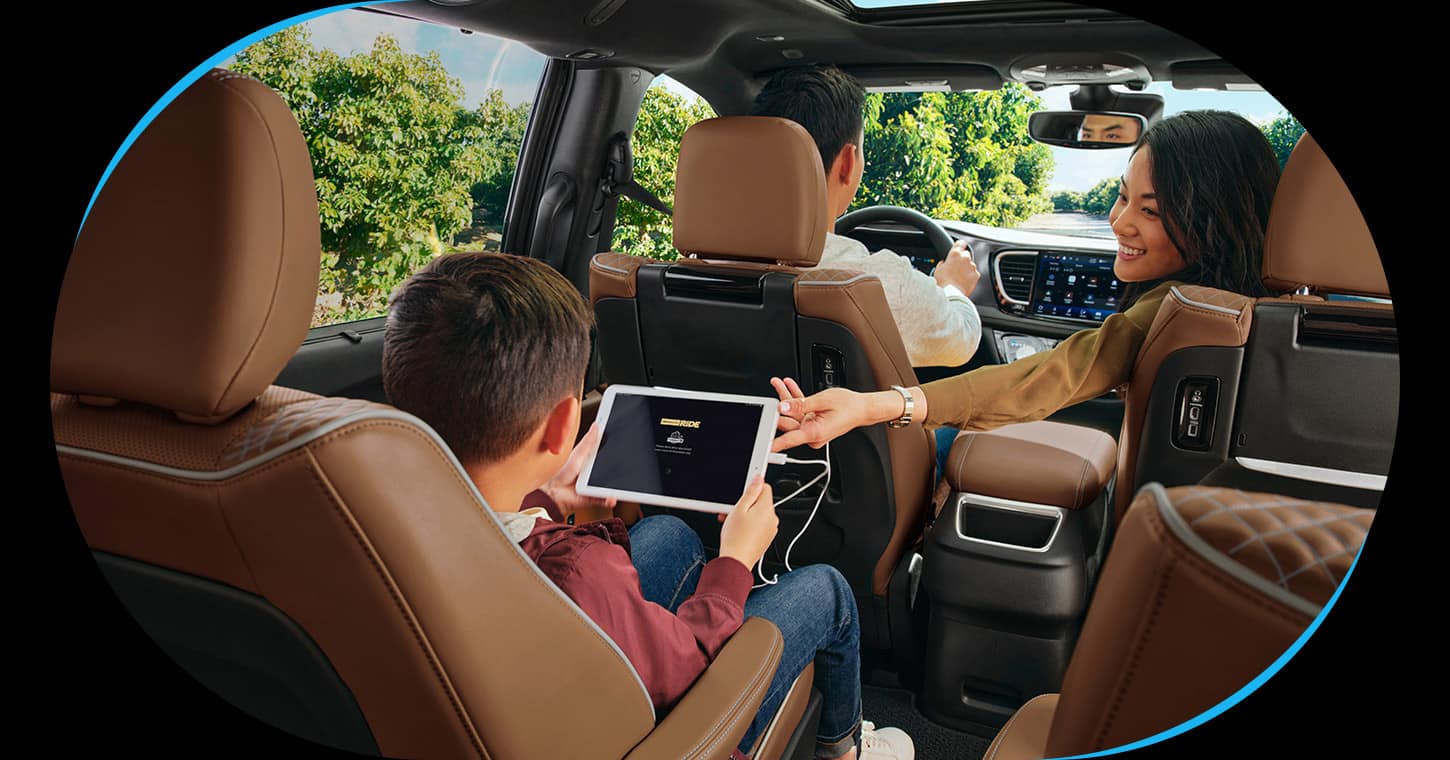 Rear-seat entertainment and family passengers in a 2026 Chrysler Pacifica.