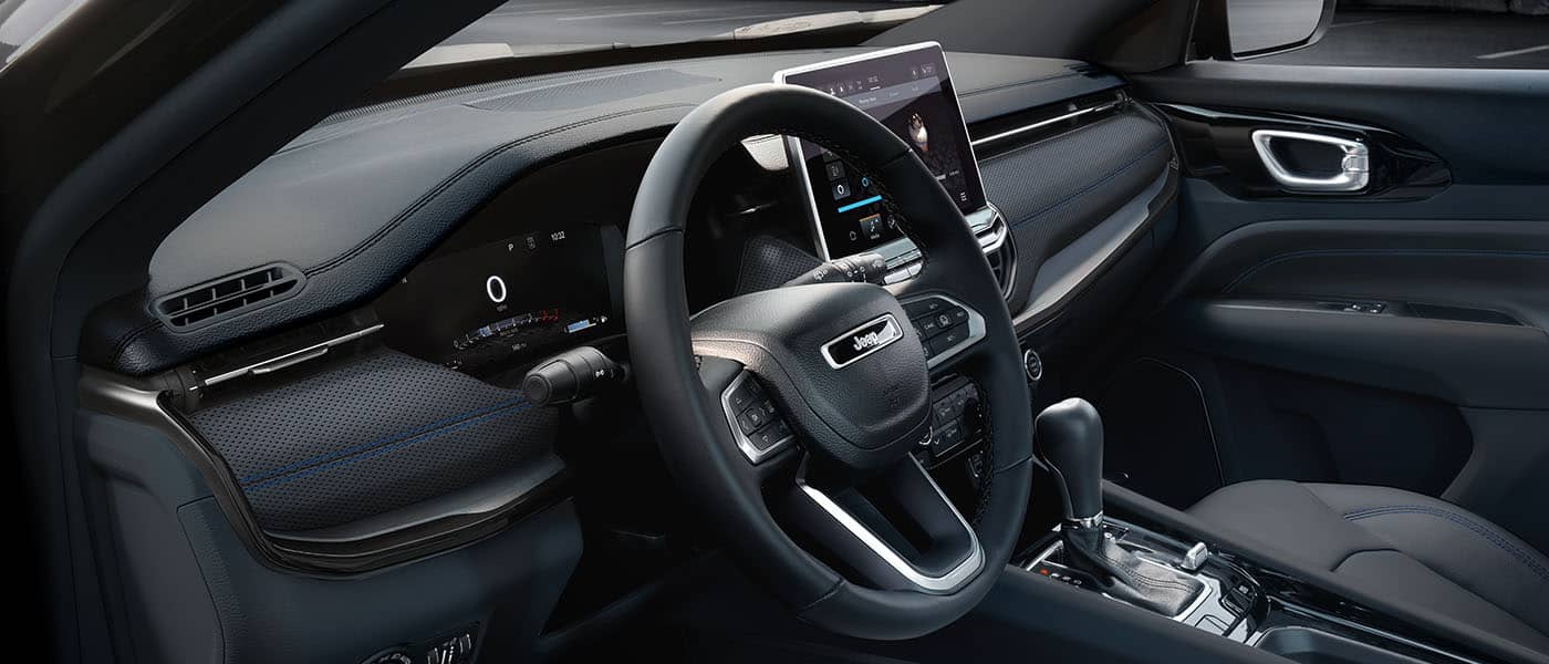 The steering wheel, Digital Cluster Display, Uconnect touchscreen and center stack controls in the 2026 Jeep Compass.