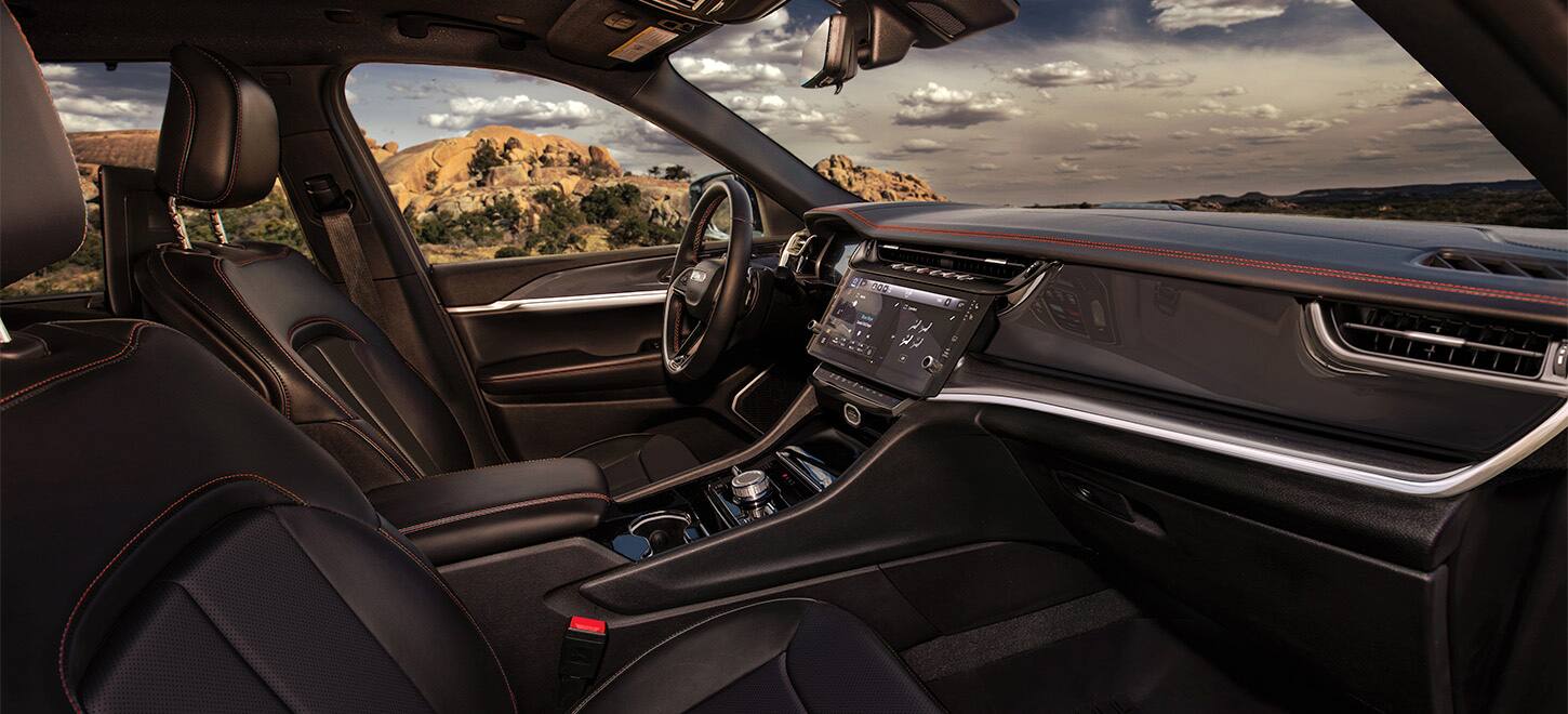 The front row in the 2026 Jeep Grand Cherokee from the perspective of the passenger side.