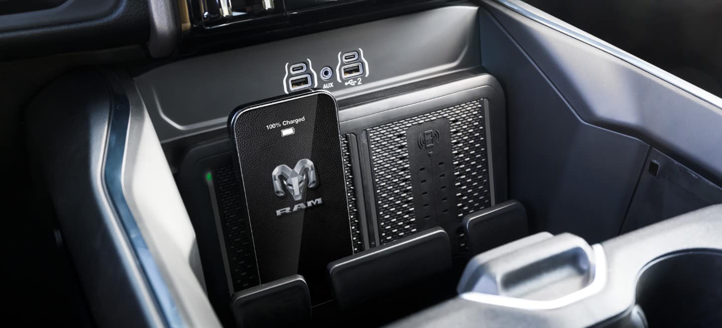 The dual wireless charging pads inside a 2026 Ram 2500 heavy duty pickup truck.