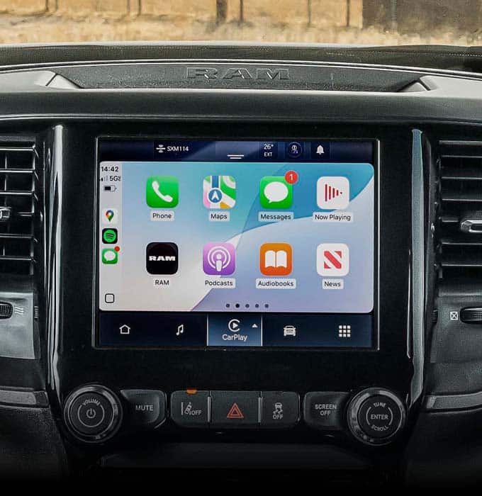 The Uconnect touchscreen in a 2026 Ram 4500 Tradesman Chassis Cab displaying a variety of selections.