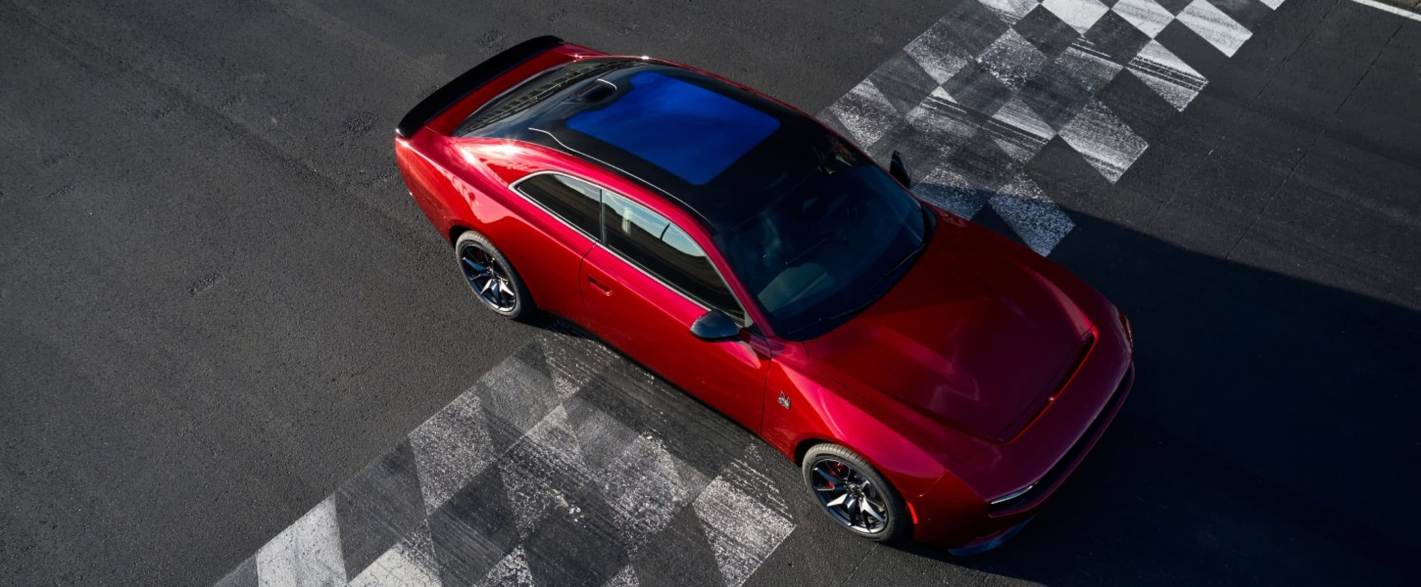 Red 2027 Dodge Charger Daytona Scat Pack viewed from above on a track